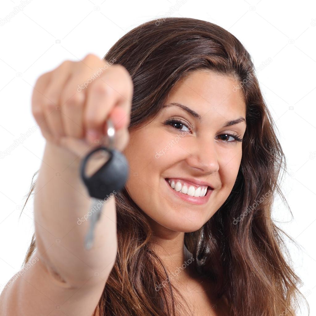 Beautiful woman smiling and holding her car key