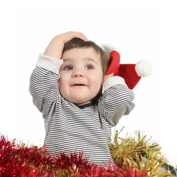 Santa claus şapka tutan güzel bebek kız — Stok fotoğraf