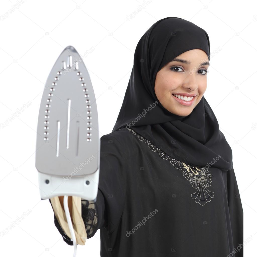 Arab housewife woman smiling and holding a smoothing iron