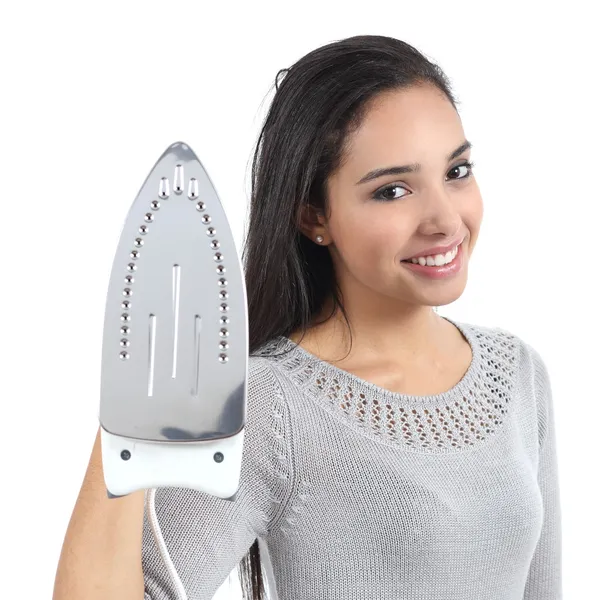 Beautiful young housewife holding a smoothing iron — Stock Photo, Image