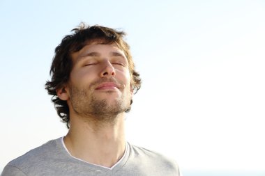 Attractive man breathing outdoor clipart