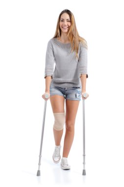 Front view of a woman walking with crutches clipart