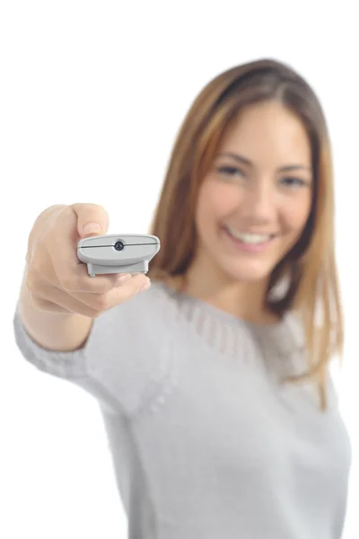 Woman pushing a button on a remote control — Stock Photo, Image