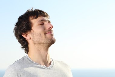 Close up of a man doing breath exercises outdoor clipart