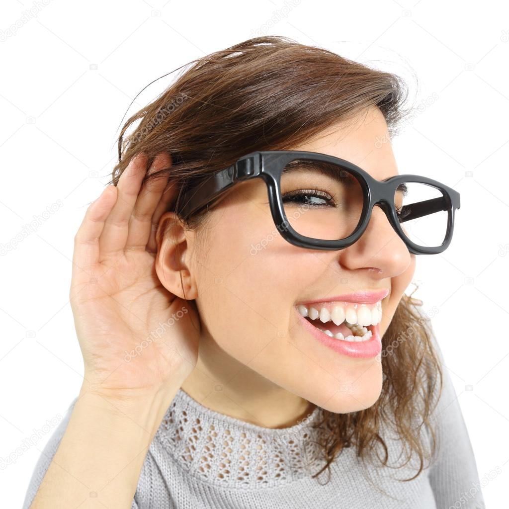 Close up of a woman listening with her hand in the ear