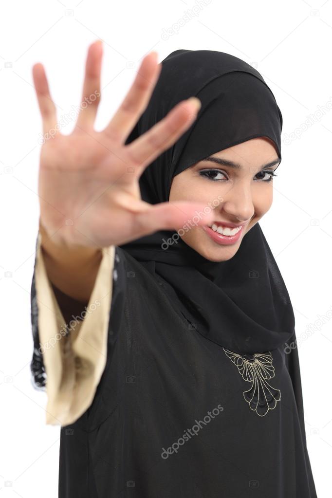 Saudi arab woman saying no photos covering her face with a hand