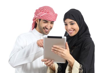 Arab saudi happy couple browsing a tablet reader clipart