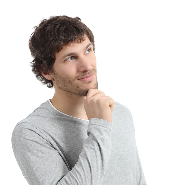 Handsome man thinking and looking above with a hand on chin — Stock Photo, Image