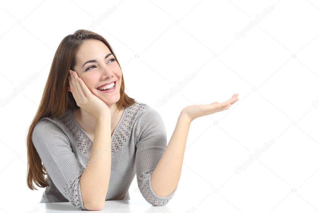Beautiful happy woman presenting a blank advertising