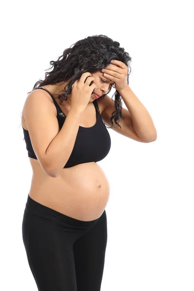 Worried pregnant woman on the phone — Stock Photo, Image