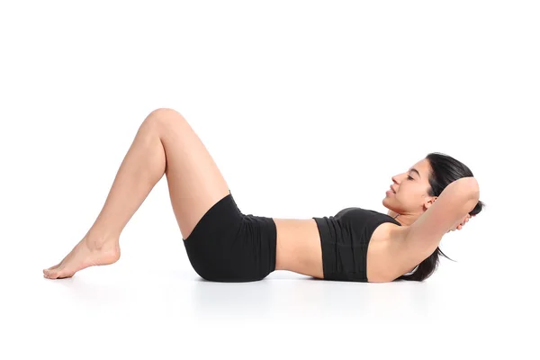 Fitness woman lying doing crunches barefoot — Stock Photo, Image