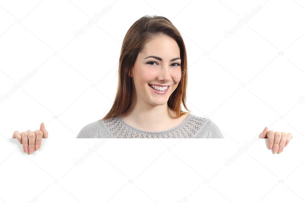 Beautiful happy woman smiling and holding a blank placard