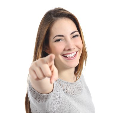 Happy woman with perfect smile pointing at camera clipart