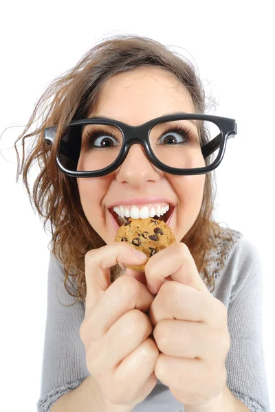 Funny geek girl eating a cookie — Stock Photo, Image