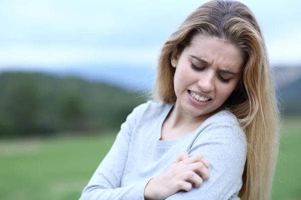 Stressed Teen Complaining Scratching Arm Field ストック写真