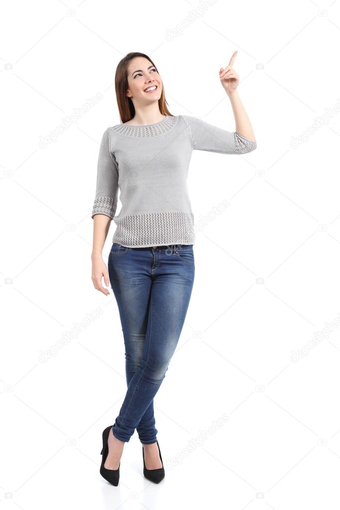 Full body of a standing casual woman pointing at side