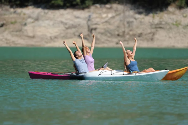 Three Excited Friends Raisng Arms Celebrating Vacation Kayak Beautiful Lake — Stock Photo, Image