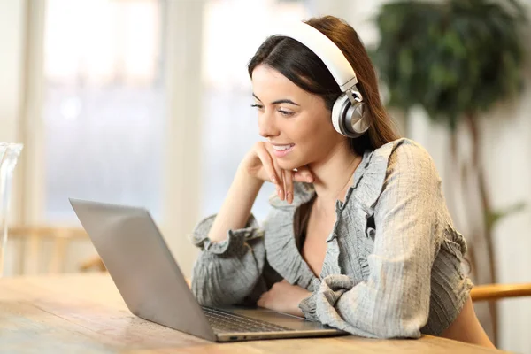 Happy Woman Watching Media Laptop Wearing Headphones Home — Stockfoto