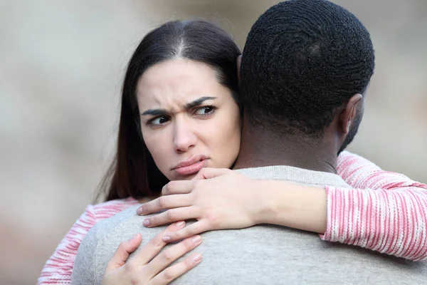 Suspicious Woman Hugging Her Friend Boyfriend Outdoors — Stock Photo, Image