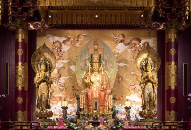 SINGAPORE - NOVEMBER 6, 2017: Buddha Tooth Relic Temple. You can see Buddha Maitreya in the middle, Bodhisattva Dharma Garden Grove on the left and Bodhisattva Great Wondrous Appearance on the right.