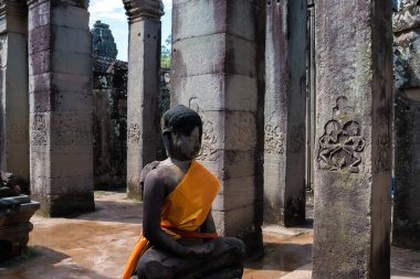 Bayon Temple, Siem Reap, Cambodia, November 2017 - view of a Buddha statue ate the entrance of the temple