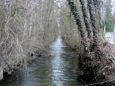 Dachau, Germany, March 2016 - view of a river at Dachau Concentration Camp Memorial Site where many jews were buried
