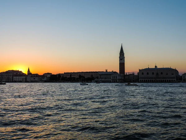 View of the Doge\'s Palace and Venice\'s bell tower during a beautiful sunset - Venice, Italy