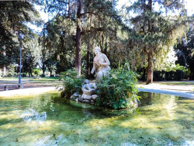 Rome, Italy, June 2017 - view of a beautiful sculpture in a fountain at Villa Borghese - Rome, Italy