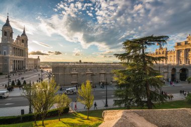 Madrid, Spain, October 2019 - view of the Royal Palace of Madrid and the Cathedral Santa Maria la Real la Almudena by the sunset 