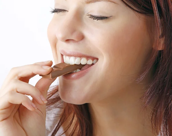 Young beautiful woman with a bar of chocolate — Stock Photo, Image