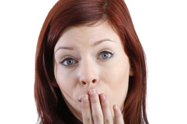 Woman with hand over mouth