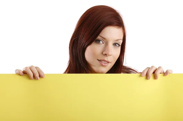 Young woman holding blank sheet — Stock Photo, Image
