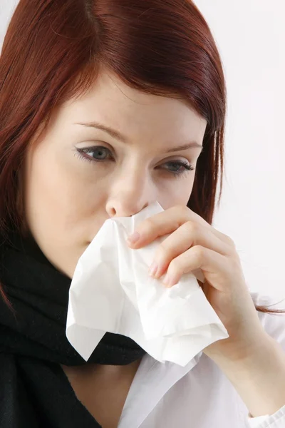 Woman blowing her nose — Stock Photo, Image