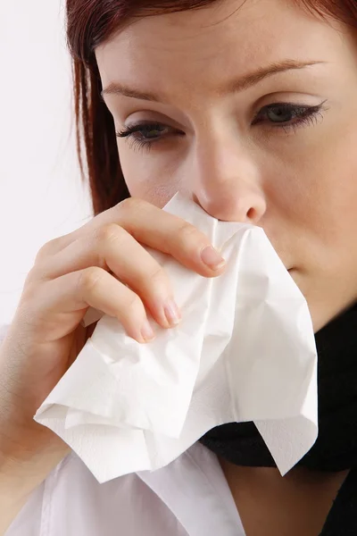 Woman blowing her nose — Stock Photo, Image