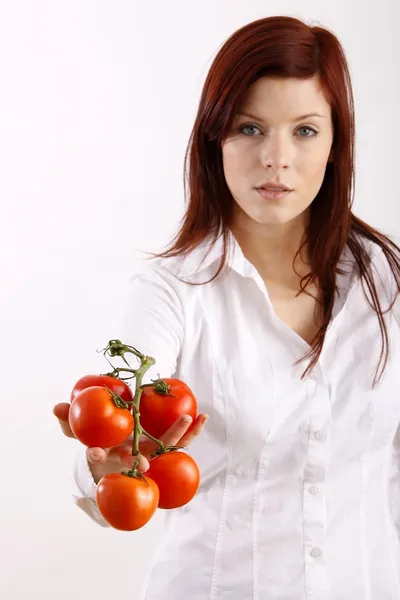 Woman holding tomatoes — Stock Photo, Image