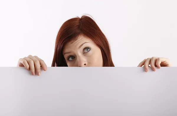 Young woman holding blank sheet Royalty Free Stock Photos