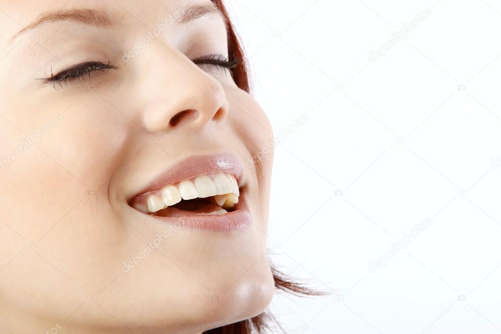 Happy woman with a white healthy teeth