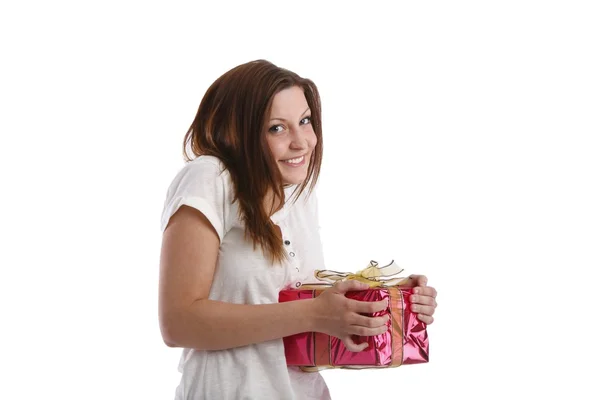 Girl posing in a white T-shirt and jeans with a box with gifts — Stock Photo, Image