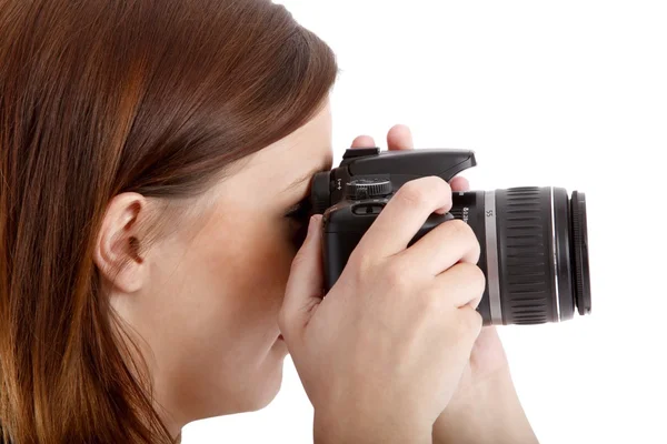 Girl posing in a white shirt with a camera — Stock Photo, Image