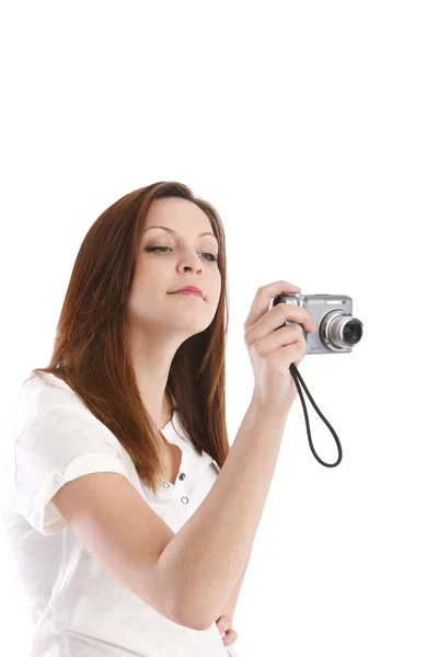 Girl posing in a white shirt with a camera — Stock Photo, Image