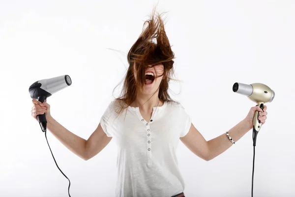 Girl with hair dryers in the hands of — Stock Photo, Image