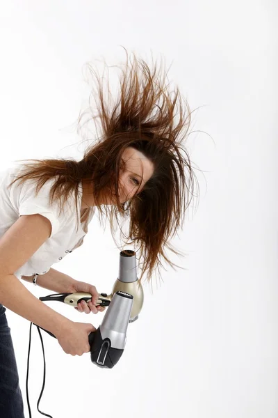 Elinde saç kurutma makinesi ile kız — Stok fotoğraf