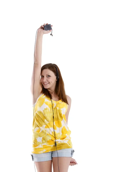 Girl in headphones listens to music — Stock Photo, Image