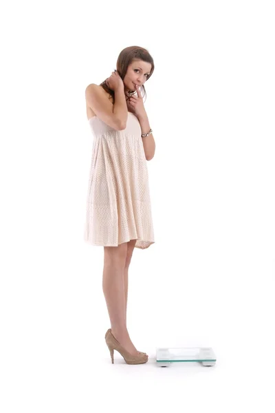 Girl in white dress with weights — Stock Photo, Image