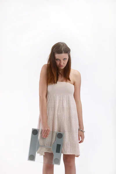 Girl in white dress with weights — Stock Photo, Image