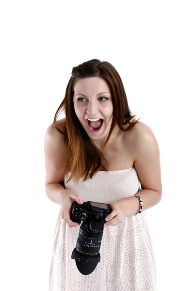 Girl posing in a white shirt with a camera — Stock Photo, Image