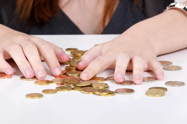 Business girl with coins — Stock Photo, Image