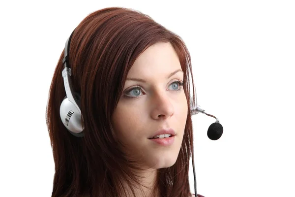 Girl talking on headphones — Stock Photo, Image