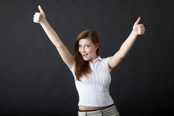 Mujer joven con los pulgares arriba —  Fotos de Stock