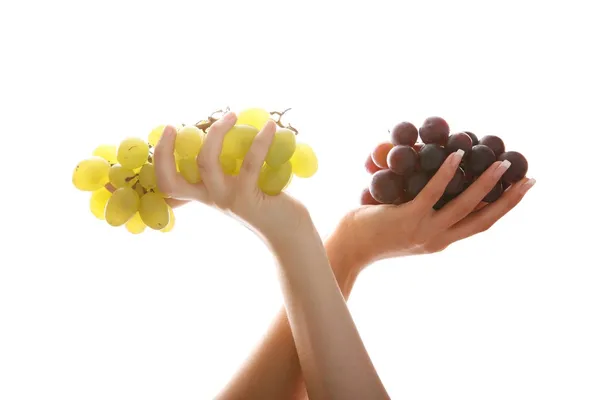 Hands with green and red grapes — Stock Photo, Image